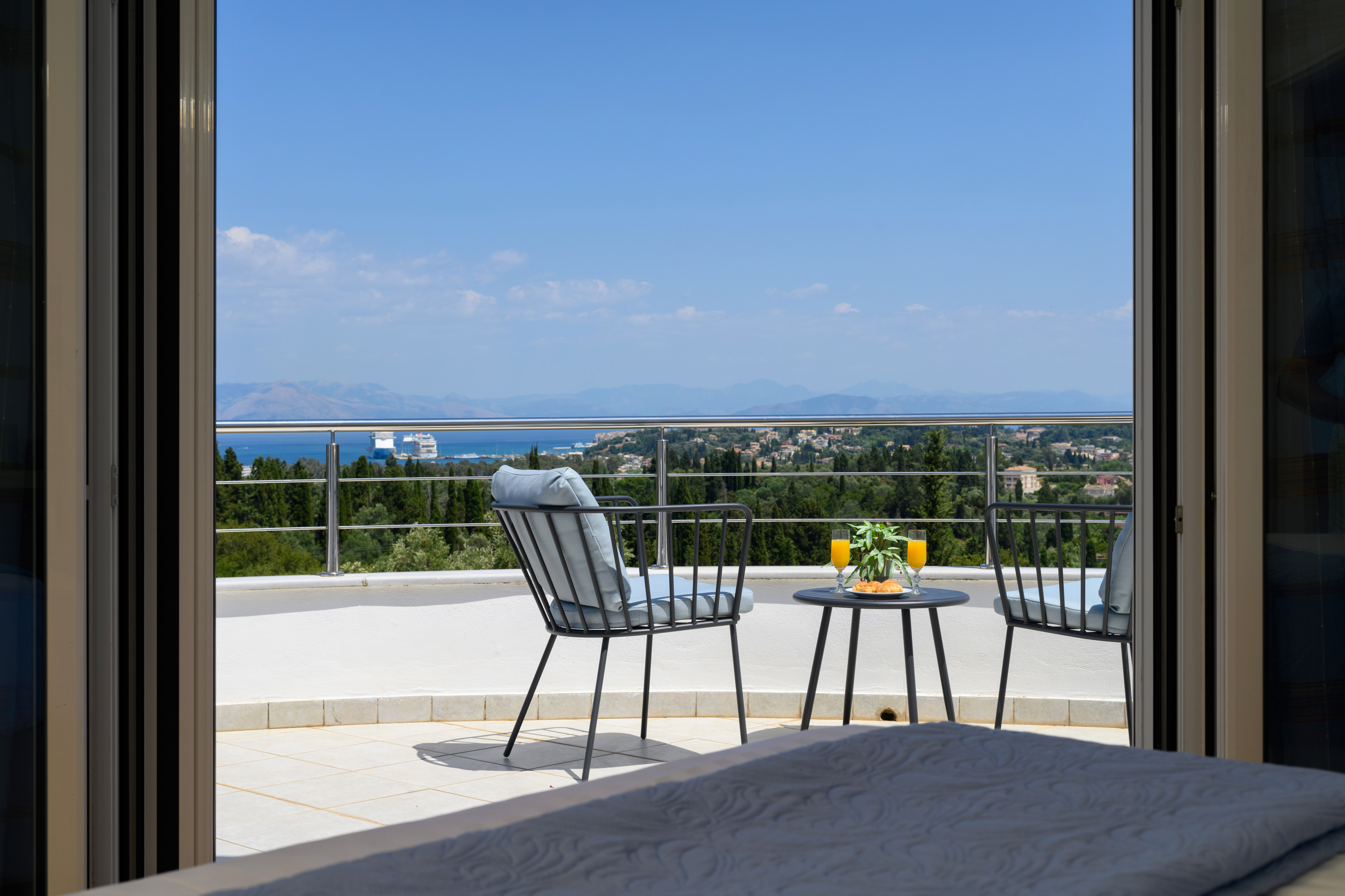 Balcony coffee table with relaxing sea view at Olga’s Luxury Villa