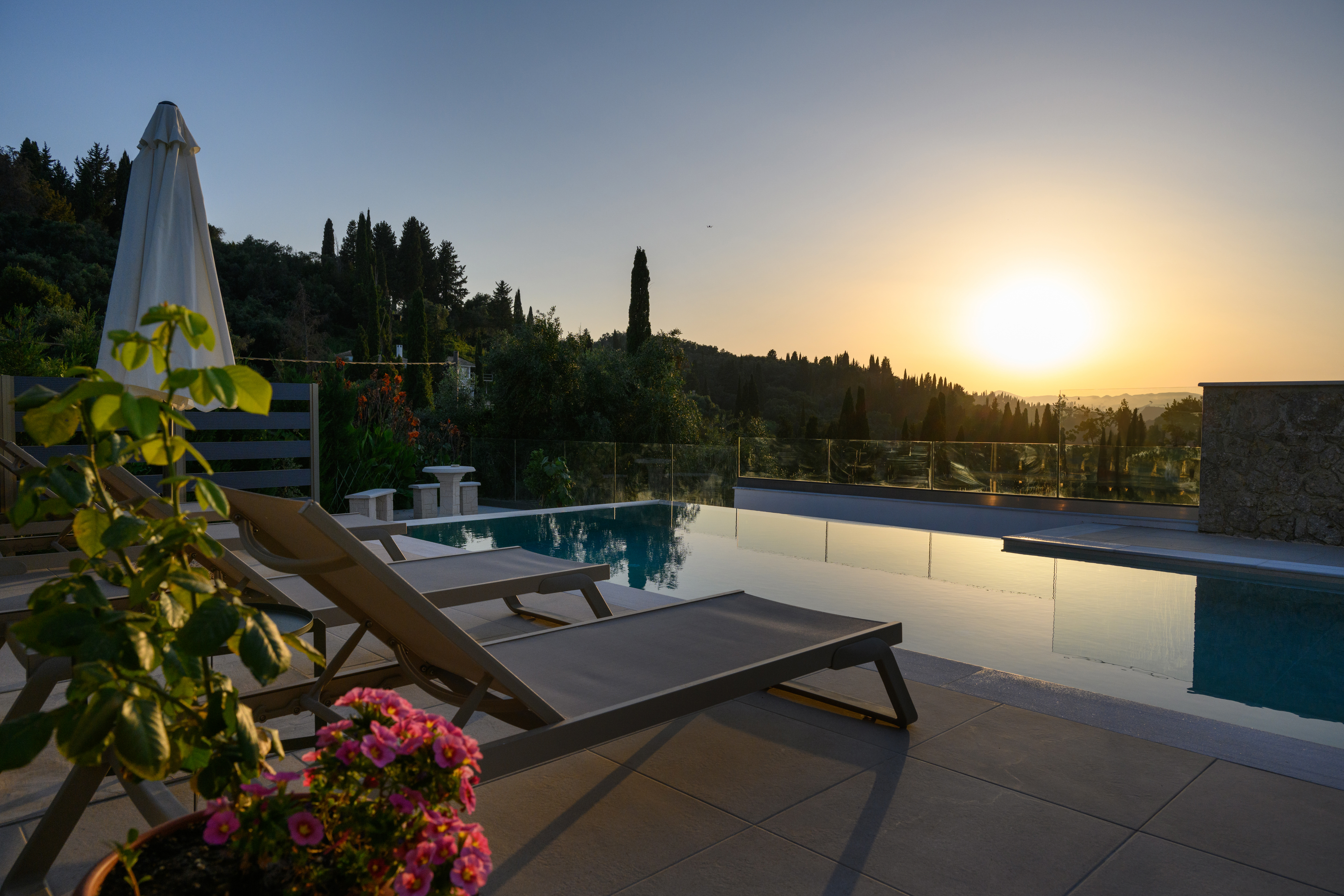 Olga’s Luxury Villa infinity pool with sunset and sea view