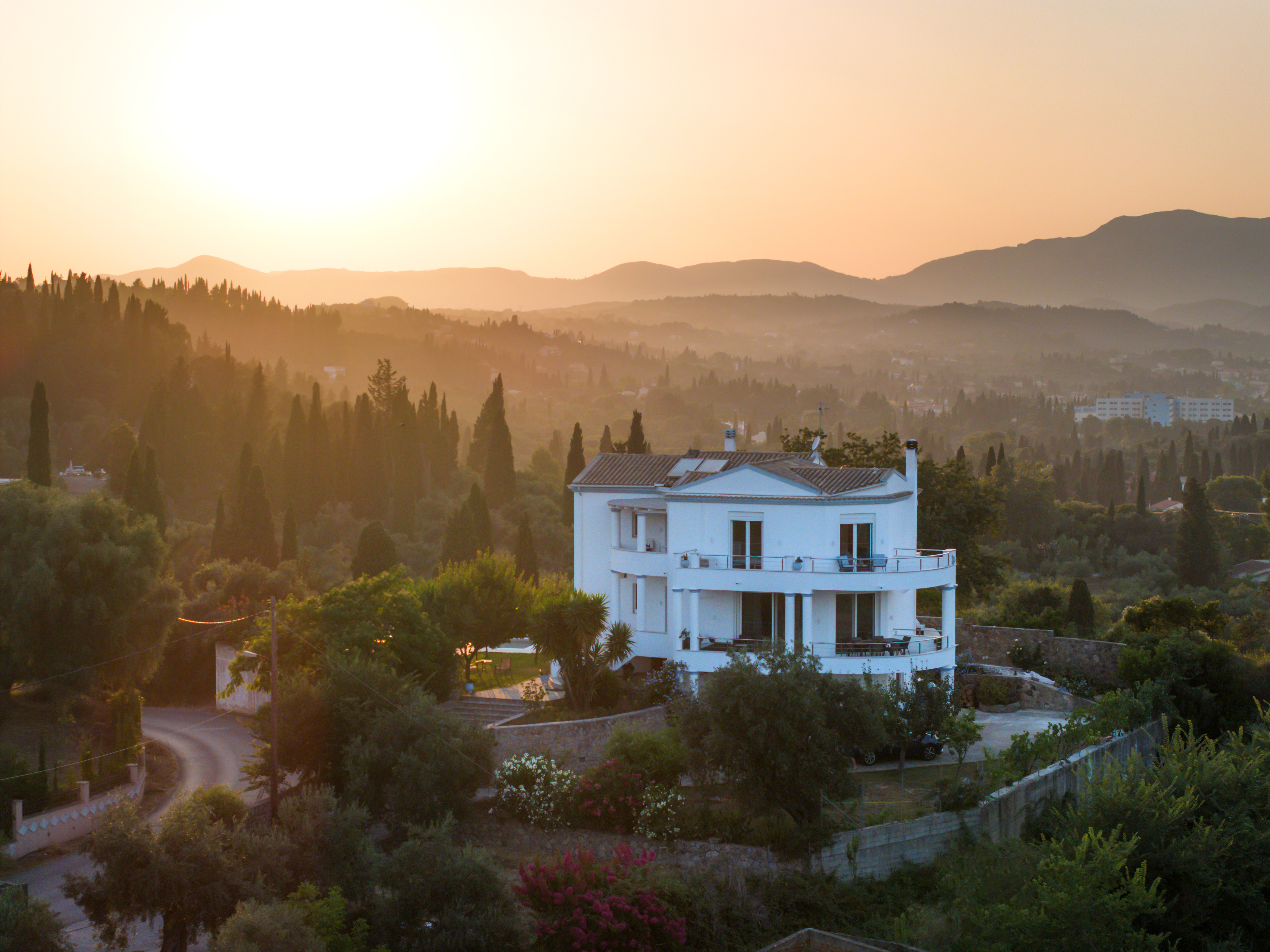 Sunset drone view of Olga’s Luxury Villa with pool and Ionian Sea view in Corfu