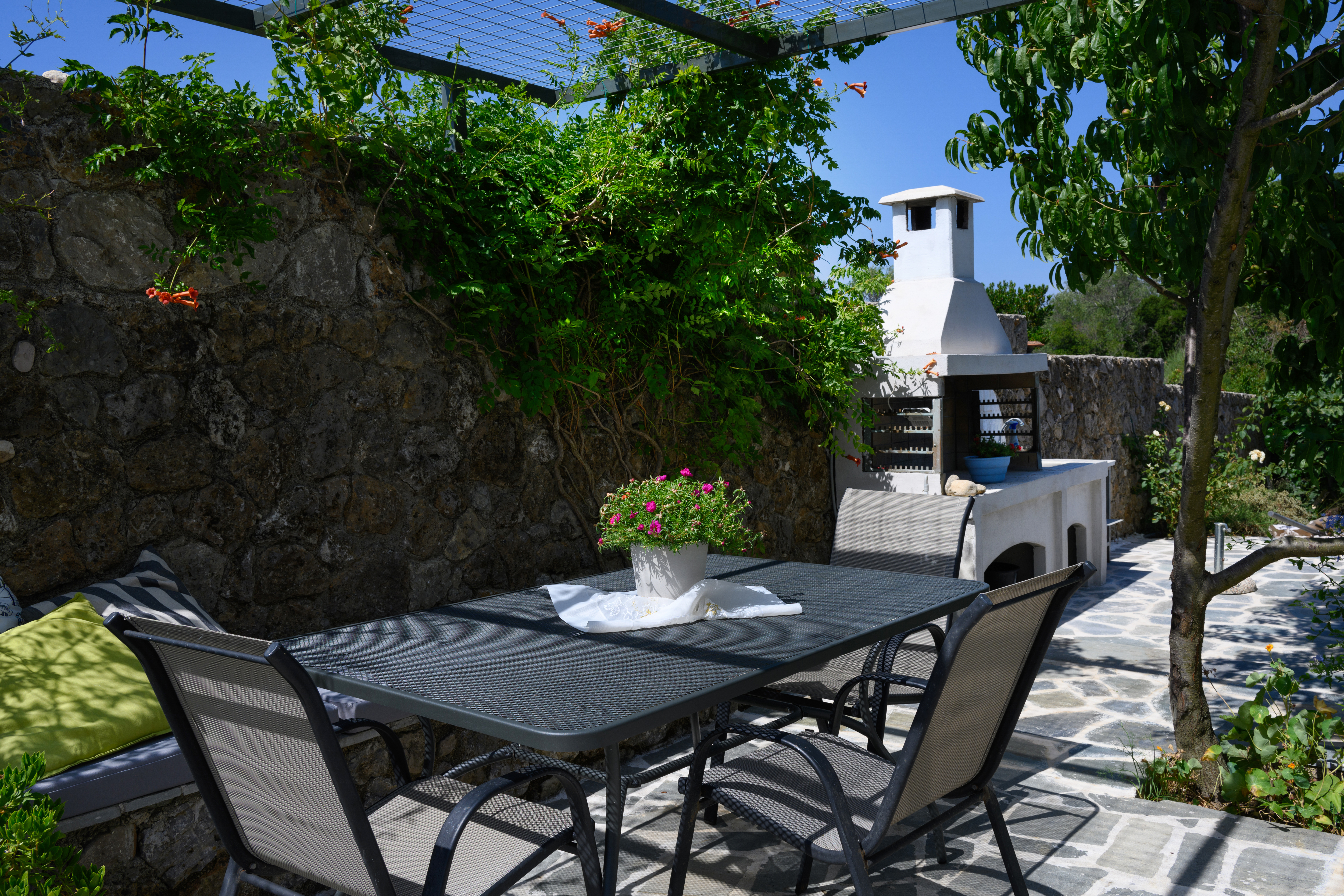 Outdoor BBQ and dining area for guests at Olga’s Luxury Villa Corfu