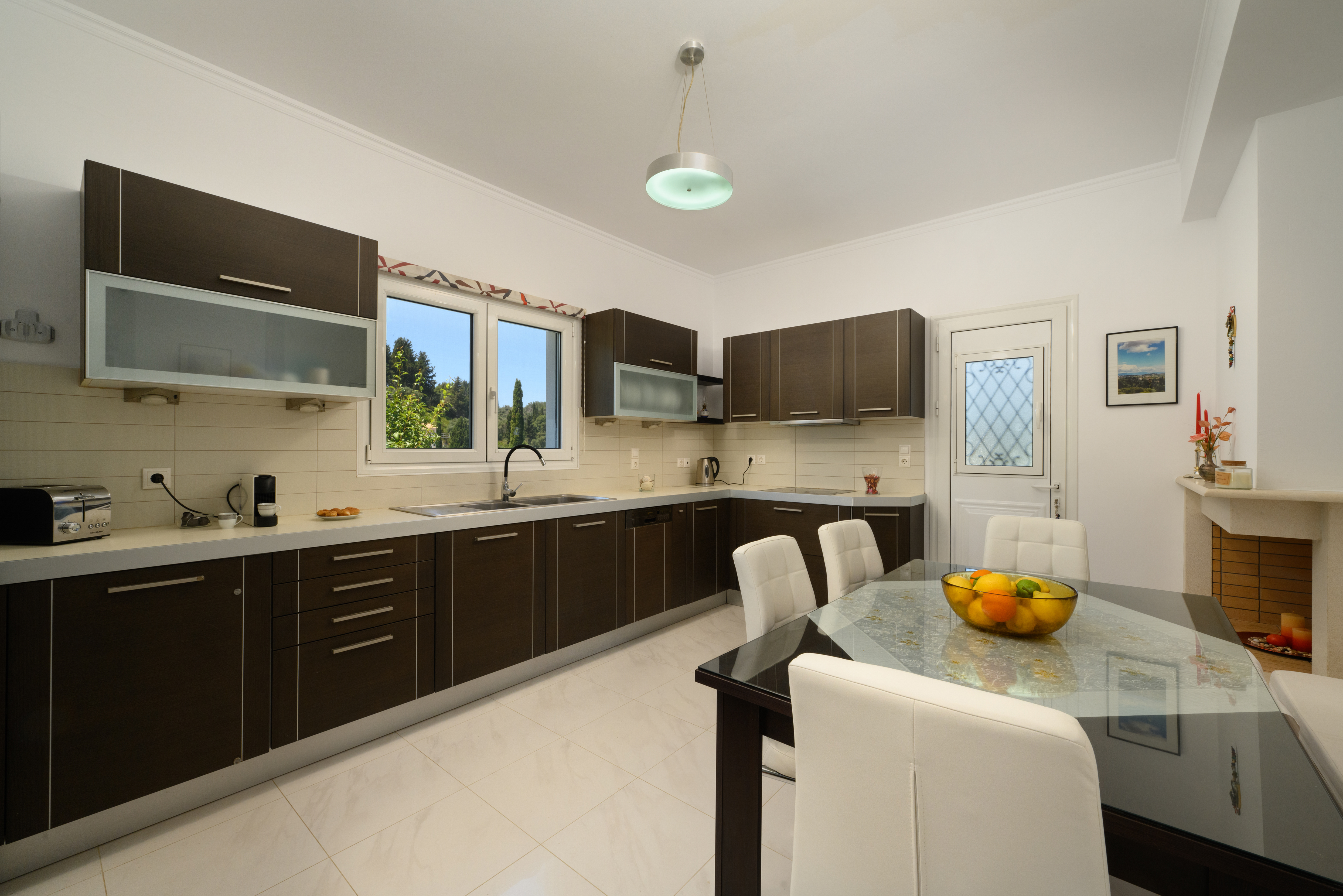 Fully equipped kitchen and dining area at Olga’s Luxury Villa Corfu