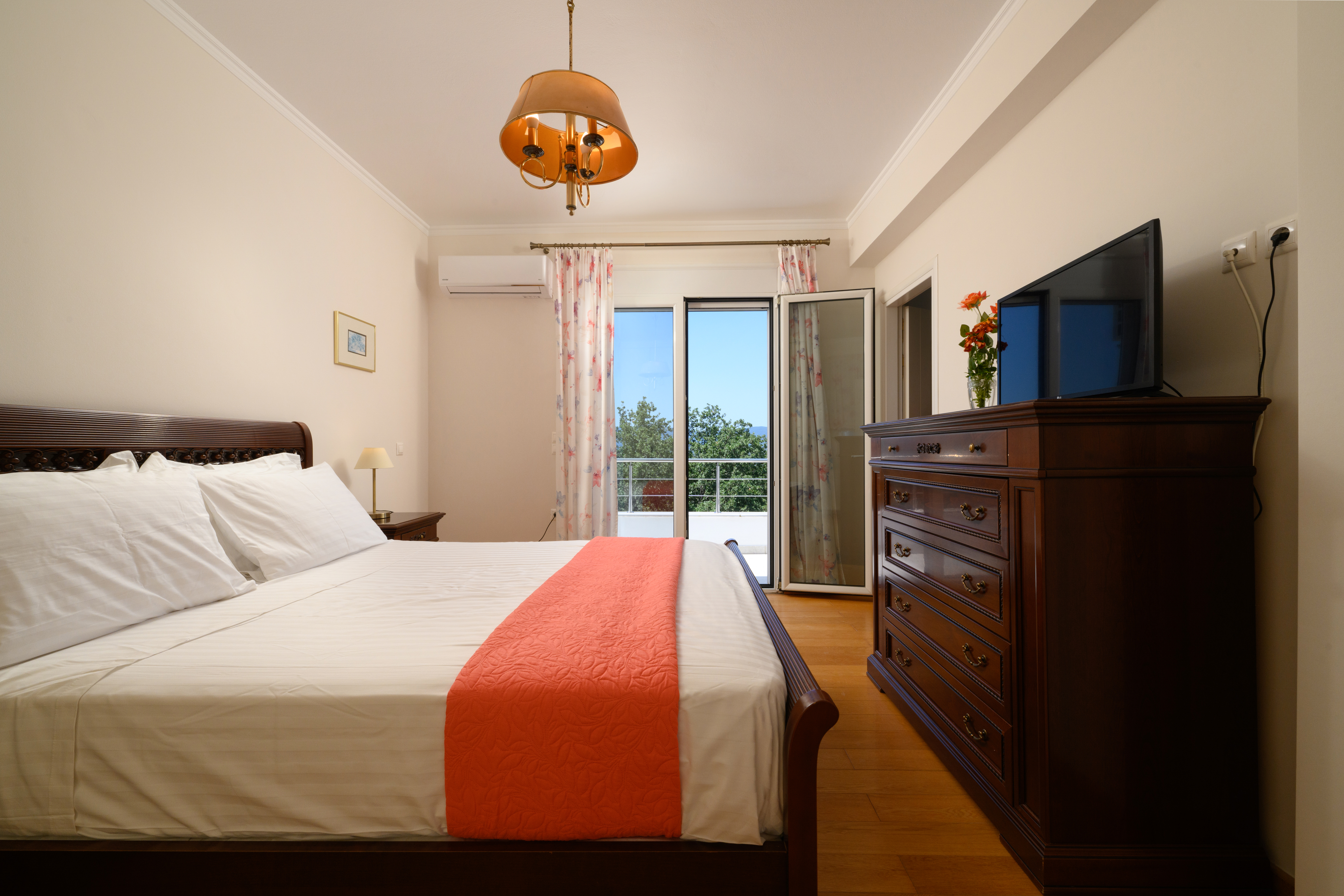 Master bedroom with elegant decor at Olga’s Luxury Villa in Corfu